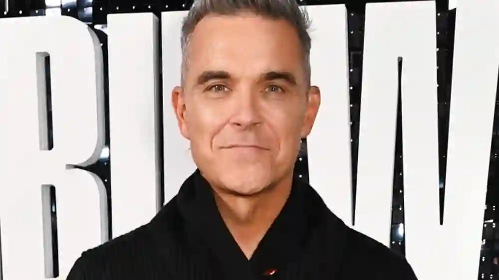 Robbie Williams Net Worth Exposed – UK Pop Icon’s Riches in 2025